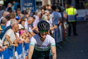 An Athlete from Aachen smiling before finishing a lap