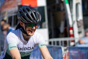 An athlete from Aachen smiling while passing by